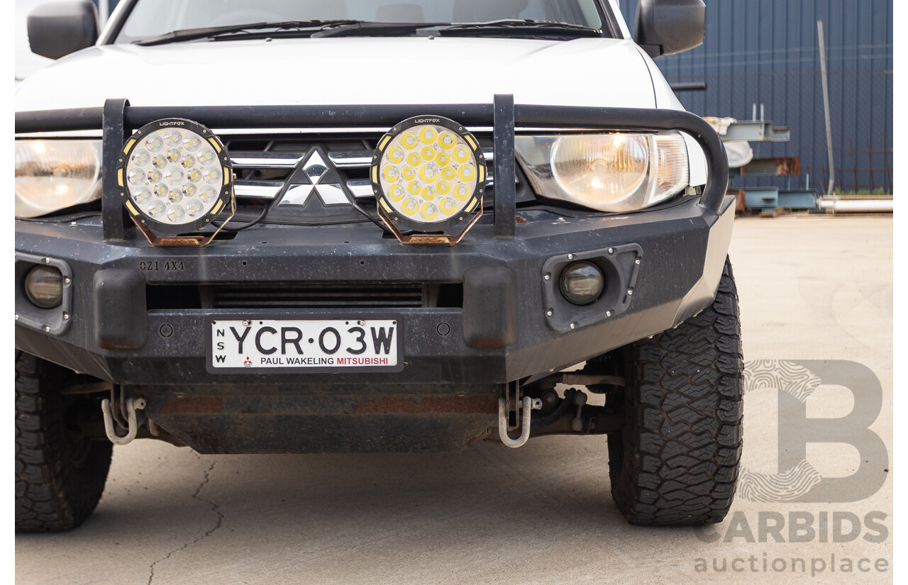 9/2014 Mitsubishi Triton GLX (4x4) MN MY14 UPDATE Double Cab Utility White Turbo Diesel 2.5L