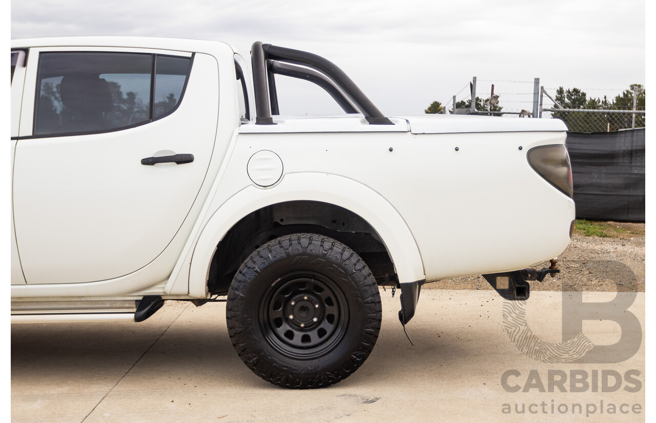 9/2014 Mitsubishi Triton GLX (4x4) MN MY14 UPDATE Double Cab Utility White Turbo Diesel 2.5L