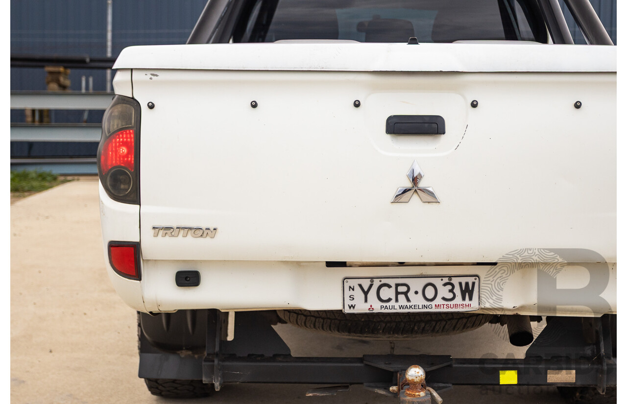 9/2014 Mitsubishi Triton GLX (4x4) MN MY14 UPDATE Double Cab Utility White Turbo Diesel 2.5L