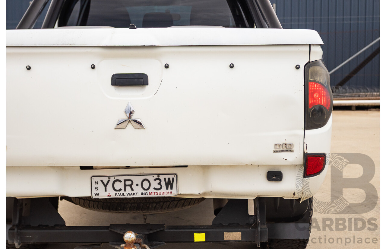 9/2014 Mitsubishi Triton GLX (4x4) MN MY14 UPDATE Double Cab Utility White Turbo Diesel 2.5L