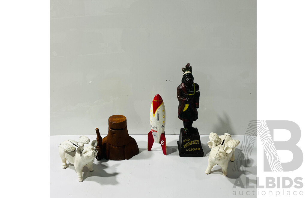 Collection of Painted Cast Iron Novelty Money Boxes Including Ned Kelly Money Box and Rocketship Moneybox