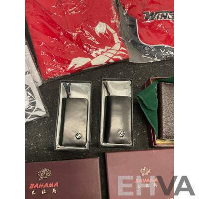 Assorted Bundle of Polo Tops (x10), Caps (x4), Wetsuit - Long Sleeve, Size M and L, Wallets (x4), Key Wallet (x2), Sunglasses (x20) and Can Coolers