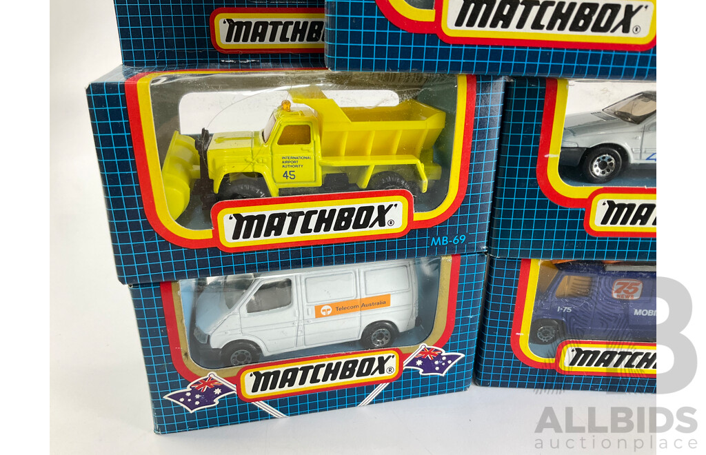 Eight Vintage Matchbox Vehicles Including Telecom Australia, School Bus, Sauber Group C, Volvo 480ES, GMC Wrecker, Land Rover 90