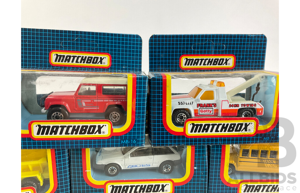 Eight Vintage Matchbox Vehicles Including Telecom Australia, School Bus, Sauber Group C, Volvo 480ES, GMC Wrecker, Land Rover 90