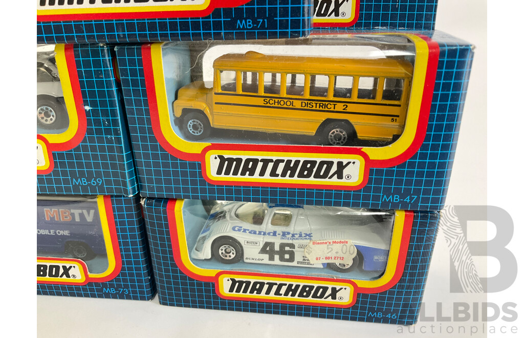 Eight Vintage Matchbox Vehicles Including Telecom Australia, School Bus, Sauber Group C, Volvo 480ES, GMC Wrecker, Land Rover 90