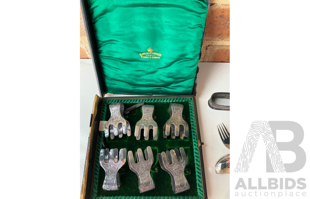 Collection of White Metal and Silver Plated Collectables, Including FLAVELLE & ROBERTS Napkin Lunt, HARDY BROS Cruet Set, RONSON Table Top Lighter, Salt and Peper Shakers and more 