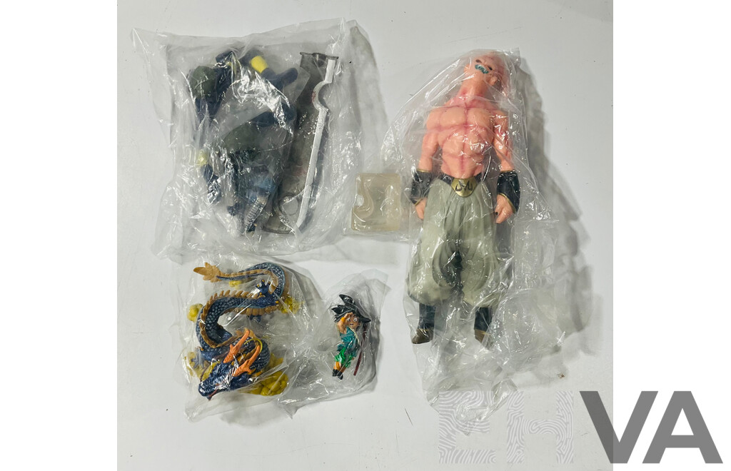 Collection of Three Figures From Different Anime Franchises Including Kakashi From Naruto, Goku and Shenron From Bragonball Z and Majin Buu From Bragon Ball Z