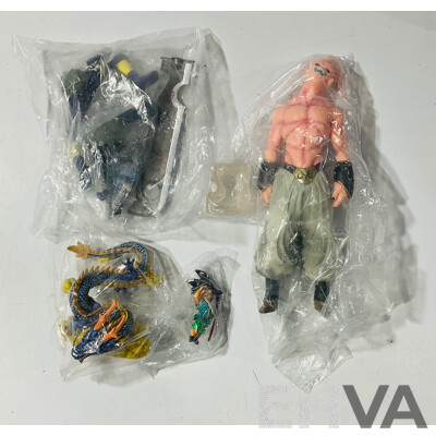 Collection of Three Figures From Different Anime Franchises Including Kakashi From Naruto, Goku and Shenron From Bragonball Z and Majin Buu From Bragon Ball Z