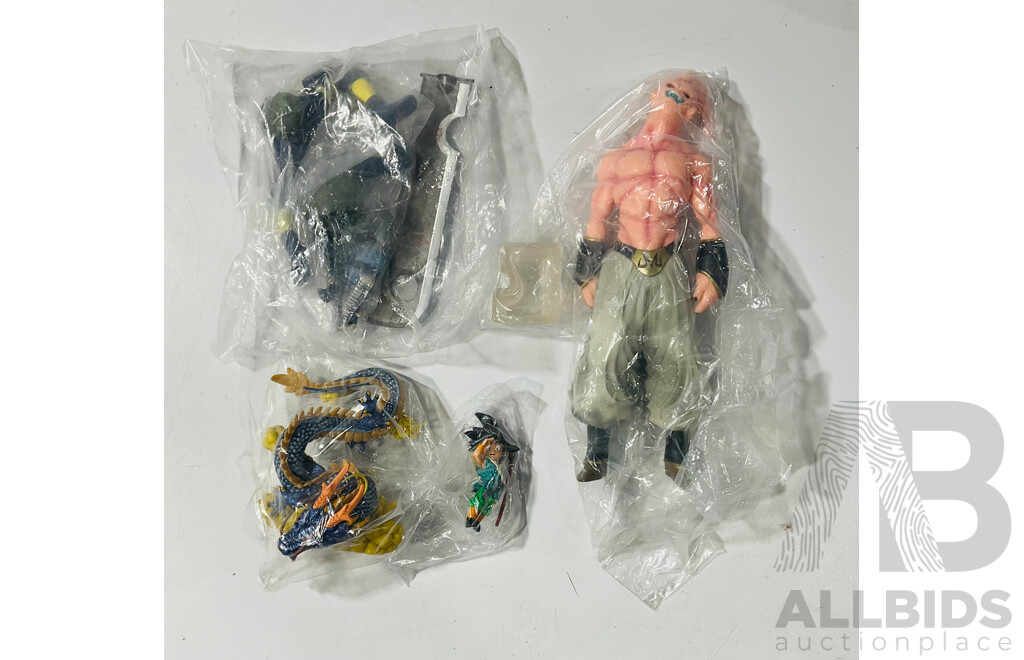Collection of Three Figures From Different Anime Franchises Including Kakashi From Naruto, Goku and Shenron From Bragonball Z and Majin Buu From Bragon Ball Z
