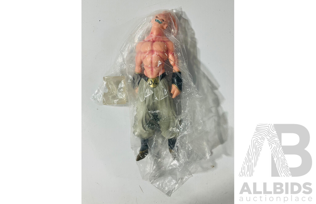 Collection of Three Figures From Different Anime Franchises Including Kakashi From Naruto, Goku and Shenron From Bragonball Z and Majin Buu From Bragon Ball Z