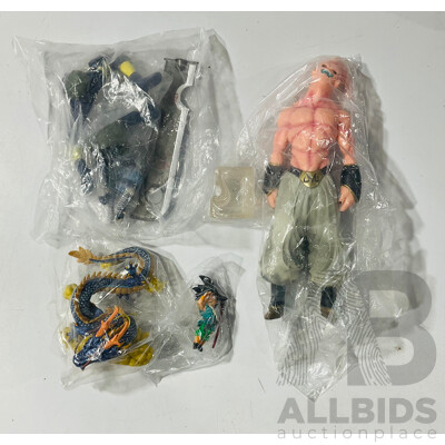 Collection of Three Figures From Different Anime Franchises Including Kakashi From Naruto, Goku and Shenron From Bragonball Z and Majin Buu From Bragon Ball Z