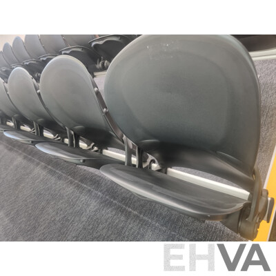 12 Rows of Camatic Theatre Seating on Carpeted Podium