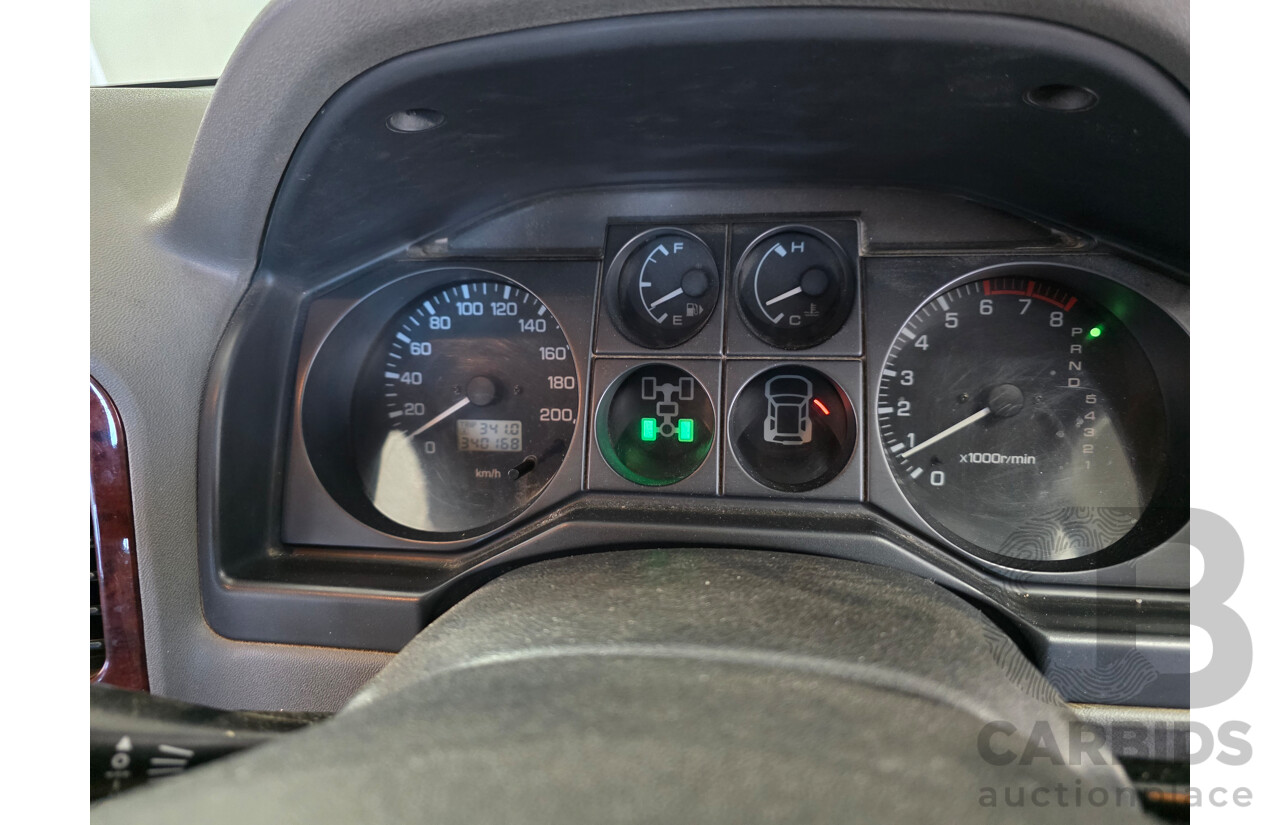 12/2003 Mitsubishi Pajero Exceed LWB (4x4) NP 4d Wagon White 3.8L - 7 Seats Dual Fuel