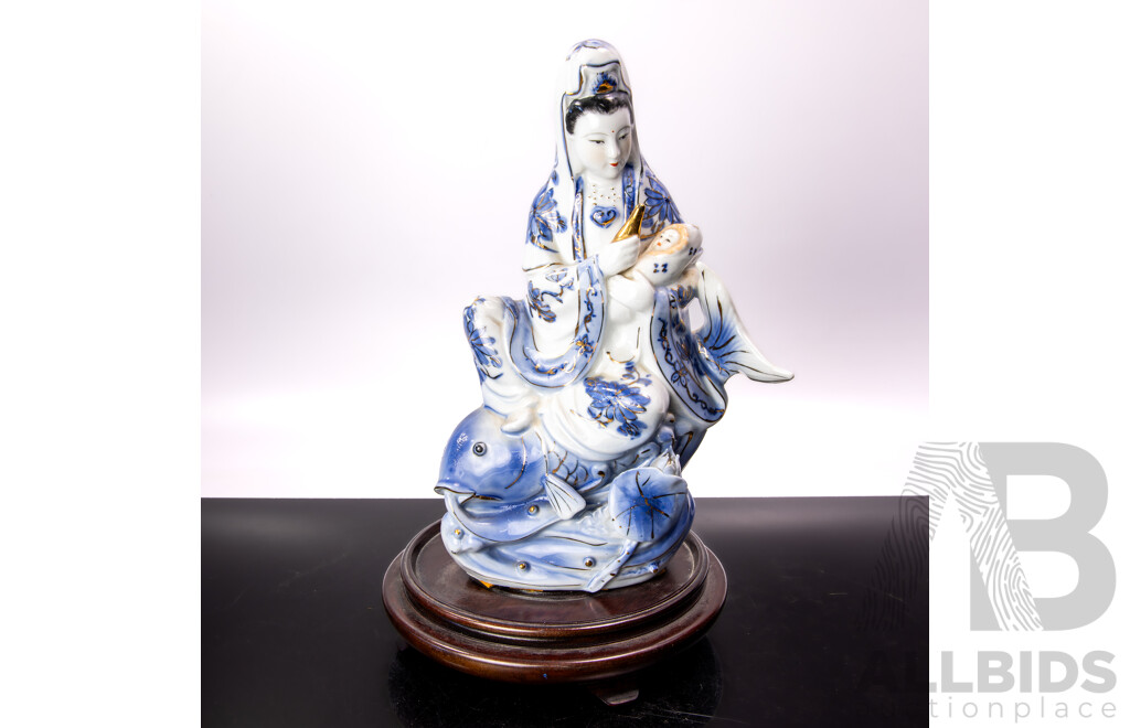 Vintage Chinese Hand Painted Porcelain Guan Yin Riding Koi with Child Figure on Lotus Base with Gilt Highlights on Wooden Base