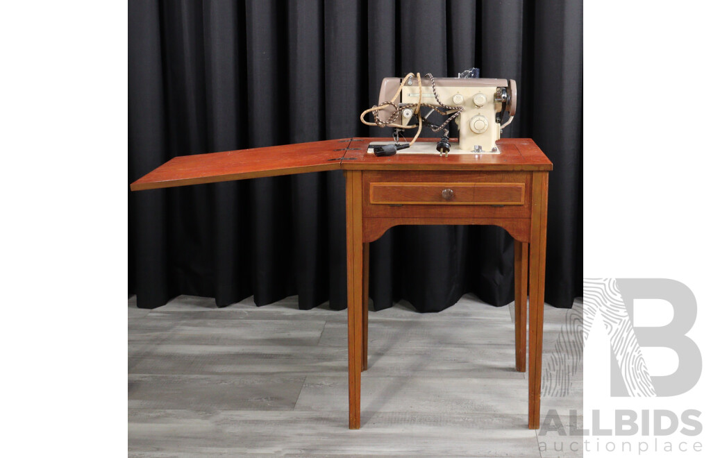 Retro Empisal Sewing Machine in Fold Over Cabinet