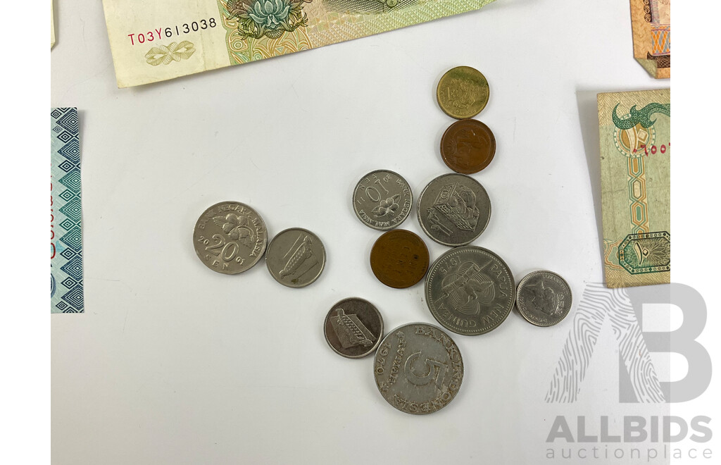 Collection of International Notes and Coins Including China, Tanzania, Chile, Indonesia, India, Philippines