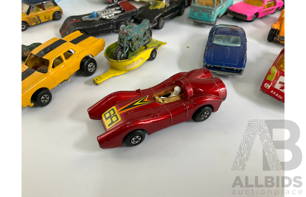 Collection of Vintage Diecast Matchbox Vehicles with Car Case and Loop Track