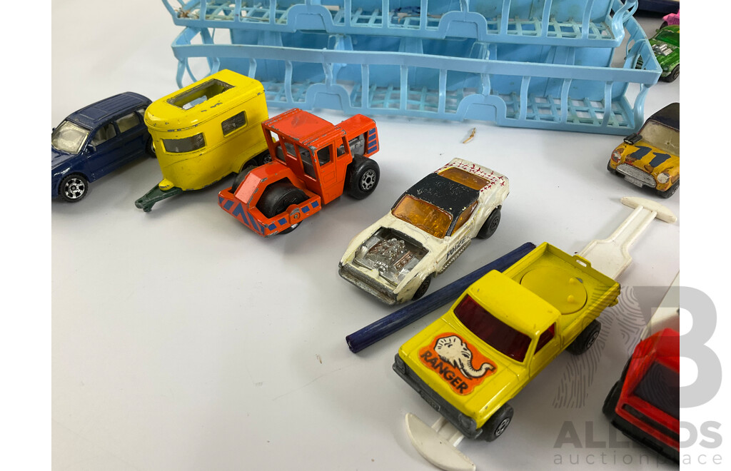 Collection of Vintage Diecast Matchbox Vehicles with Car Case and Loop Track