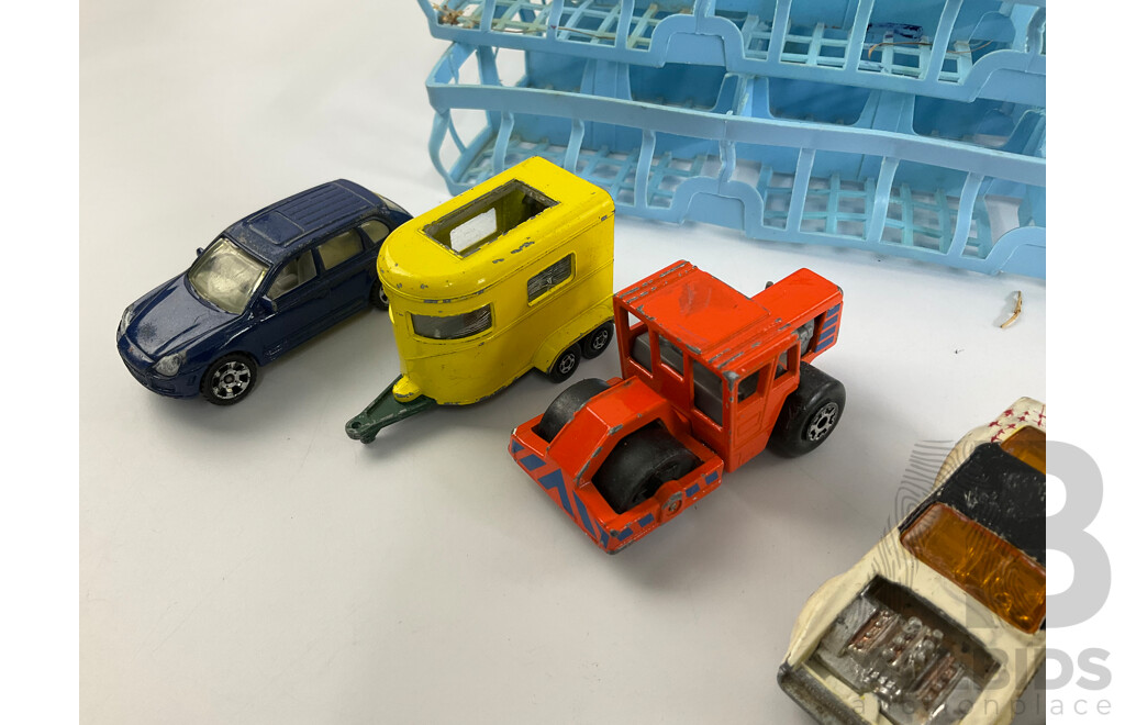 Collection of Vintage Diecast Matchbox Vehicles with Car Case and Loop Track