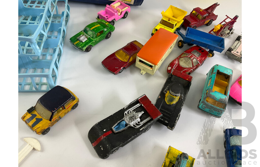Collection of Vintage Diecast Matchbox Vehicles with Car Case and Loop Track