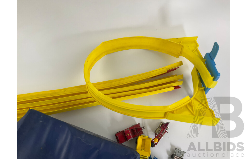 Collection of Vintage Diecast Matchbox Vehicles with Car Case and Loop Track