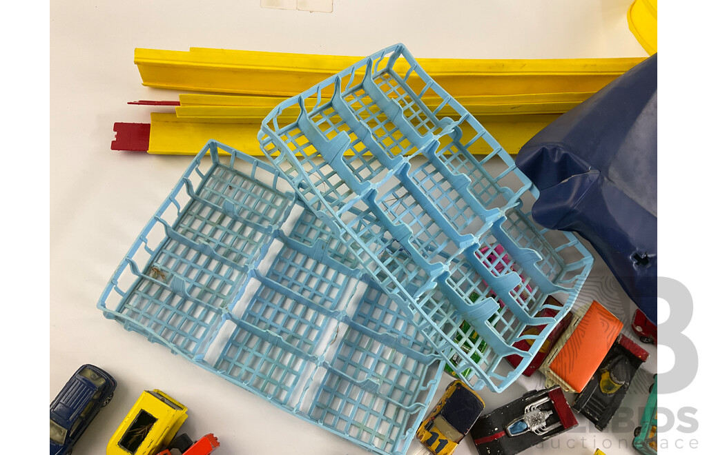Collection of Vintage Diecast Matchbox Vehicles with Car Case and Loop Track