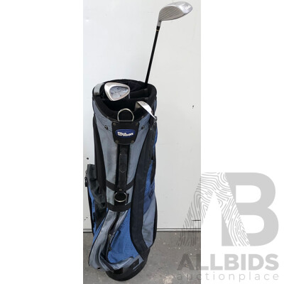 Set of Four Golf Clubs and Wilson Golf Bag