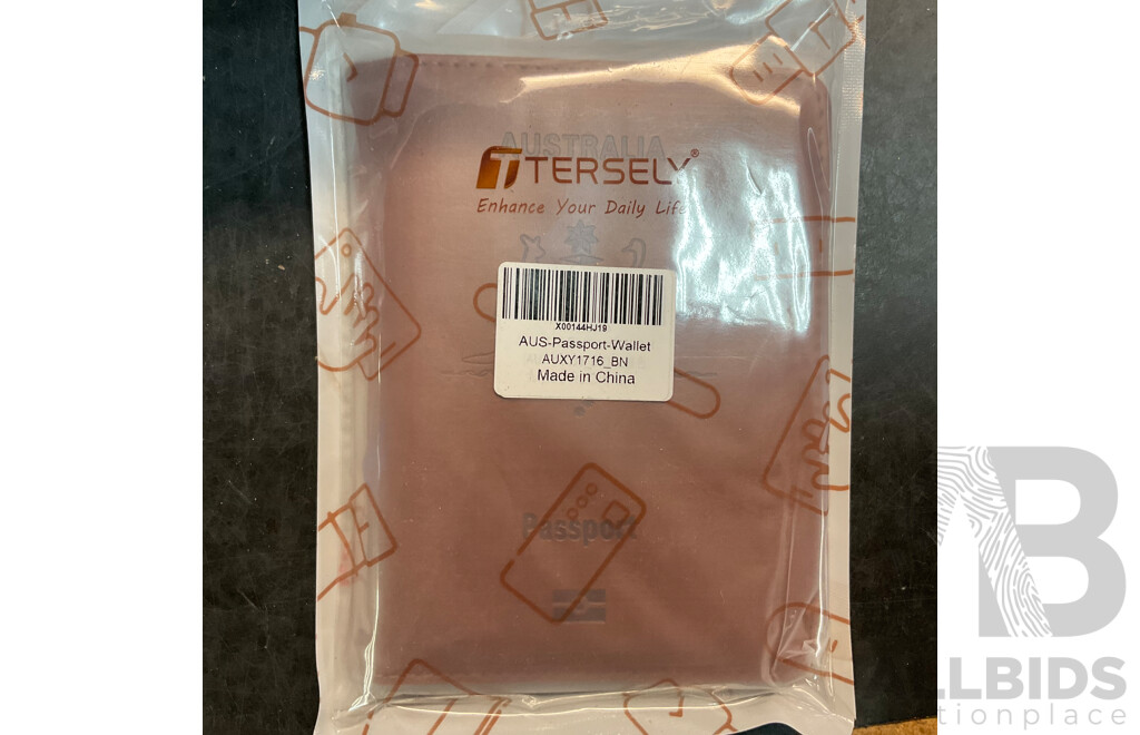 Mixed Lot Includes Passport Wallet, Soy Sauce Dispenser, Nose Hair Remover, Mini Flashlight, and Assorted Baking Items and More.