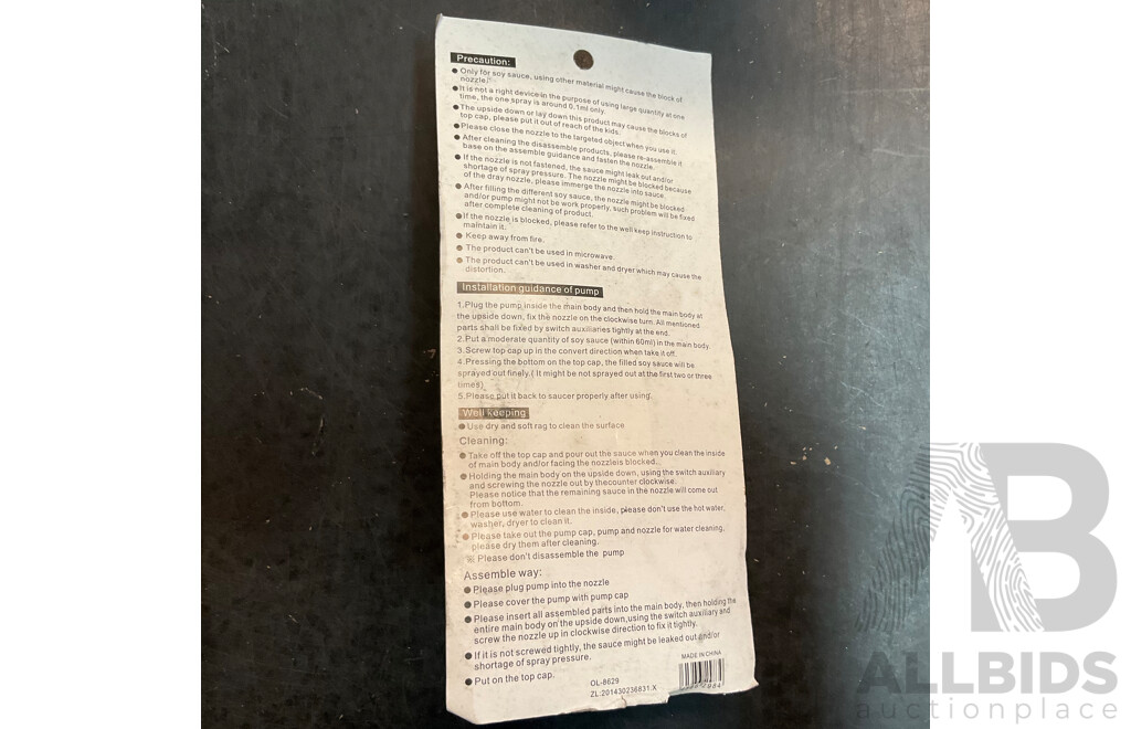 Mixed Lot Includes Passport Wallet, Soy Sauce Dispenser, Nose Hair Remover, Mini Flashlight, and Assorted Baking Items and More.