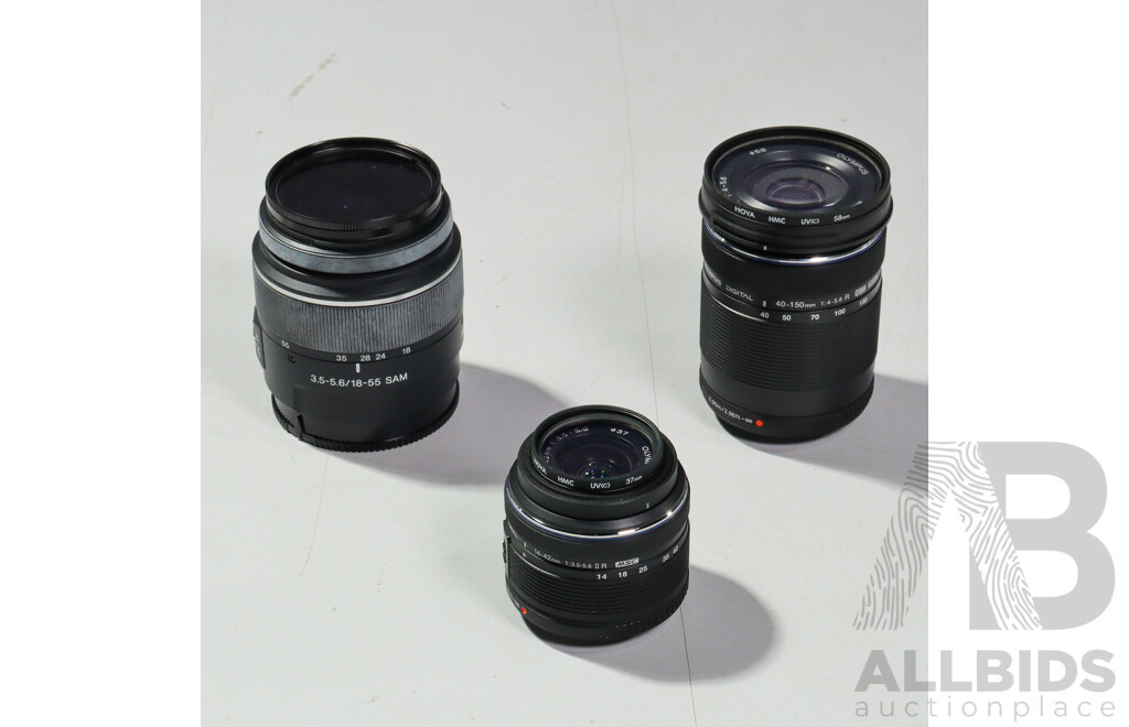 Collection Camera Equipment Including Olympus OM D Camera, Sony SAL 1855 Lens, Two Olympus Digital Lenses and More