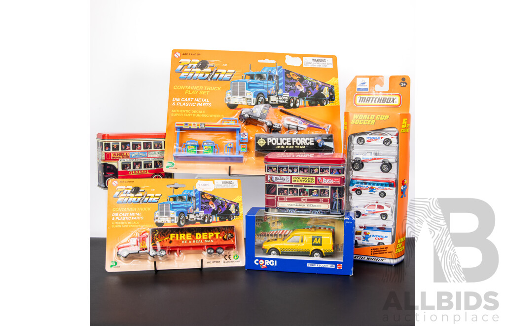 Collection of Boxed Diecast Vehicles Including Matcbox World Cup Set, Corgi Ford Escort Van, Proline Truck Sets, Two Beechworth Sweets Tin Buses
