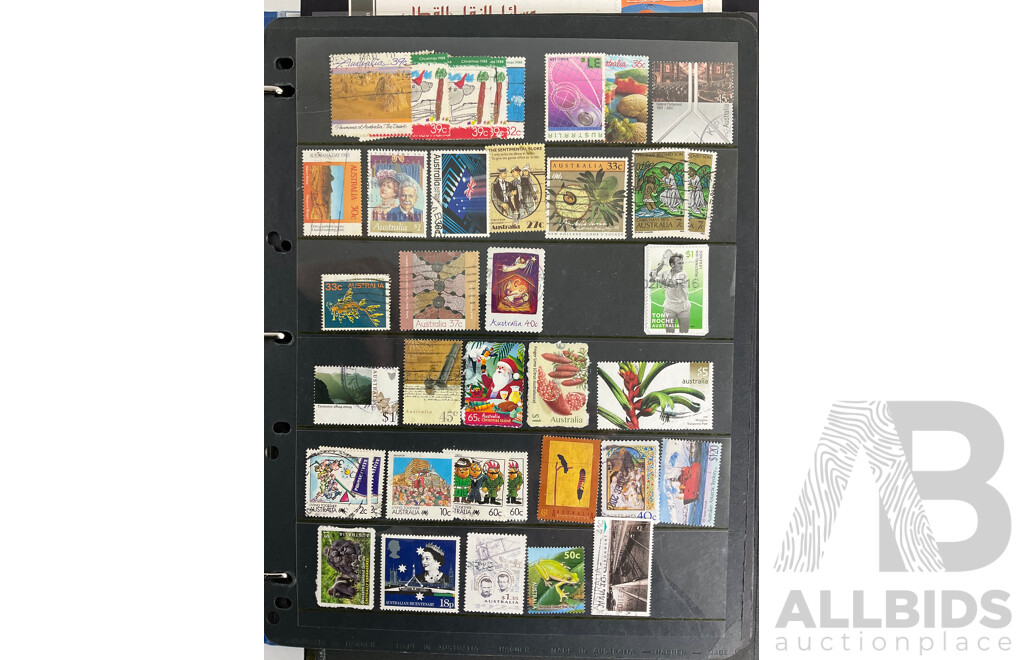 Album of International Stamps Including Australia, USA, UK, Maldives, Pakistan, Malta, Mints