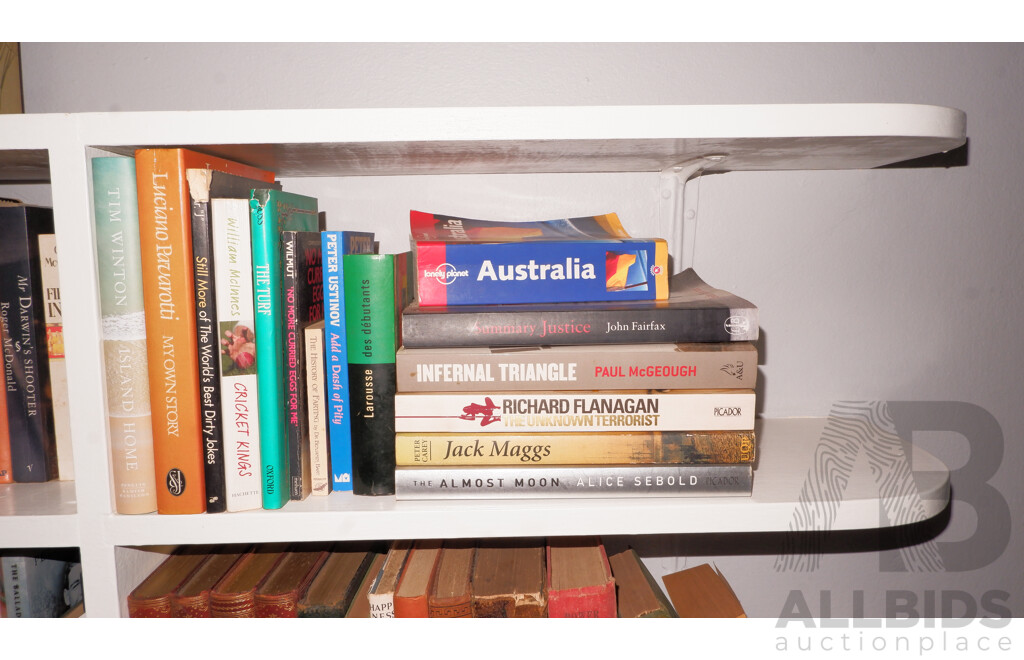 Large Collection of Books on Book Shelves in the Middle Room