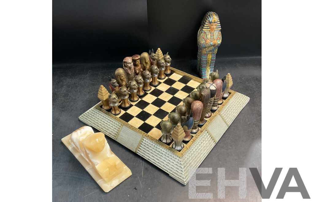 Assorted Egyptian Themed Items, Including Composite Chess Set, Sarcophagus and Onyx Sphinx Statue - Lot of 3