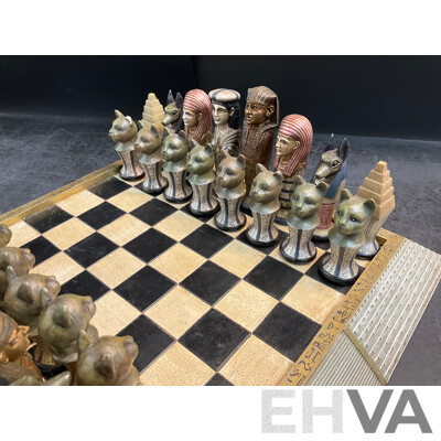 Assorted Egyptian Themed Items, Including Composite Chess Set, Sarcophagus and Onyx Sphinx Statue - Lot of 3