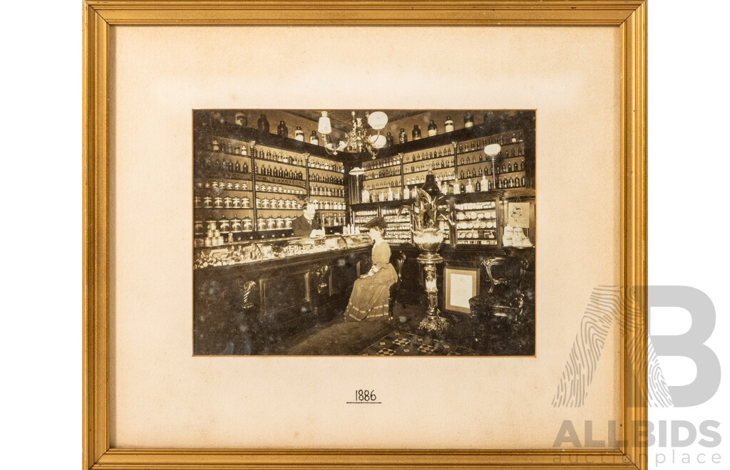 Artist Unknown, (1880s), Wonderful Antique Photograph of an Apothecary with Lady Seated & Man Behind Counter (1886), 28 x 33 cm (frame)