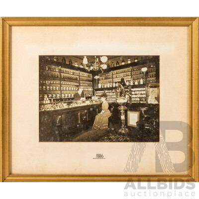 Artist Unknown, (1880s), Wonderful Antique Photograph of an Apothecary with Lady Seated & Man Behind Counter (1886), 28 x 33 cm (frame)