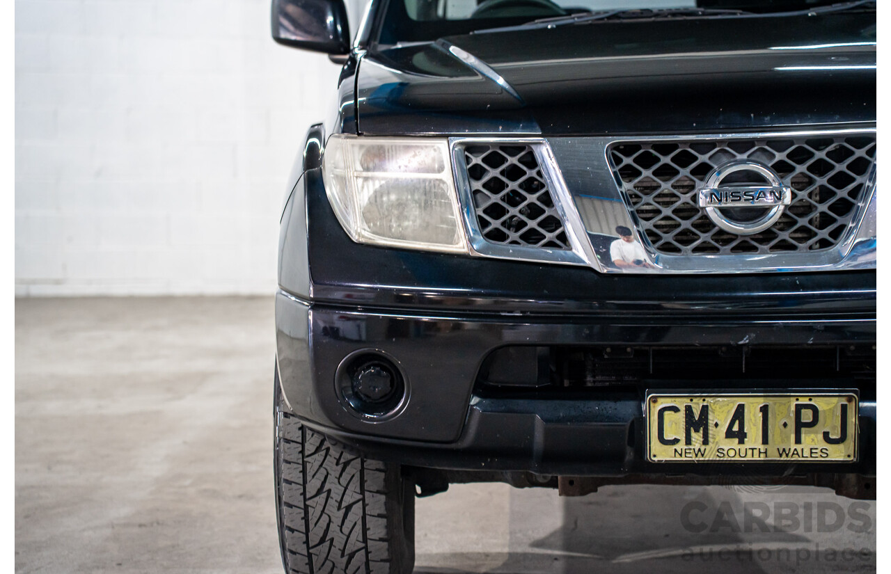 3/2013 Nissan Navara RX (4x2) D40 MY13 Dual Cab P/Up Cosmic Black Metallic Turbo Diesel 2.5L