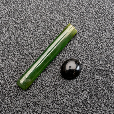 Jade Carved Long Rectangular Cabochon, 7.60ct & Onyx Oval Cabochon 2.50ct