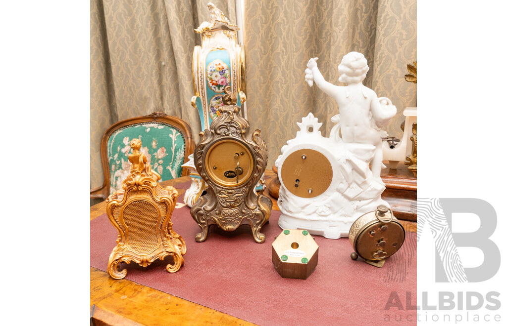 Collection Five Clocks Including Small Brass US Navy Example, Two Reproduction Gilt Style Examples and Bisque Example with Cherub Detail