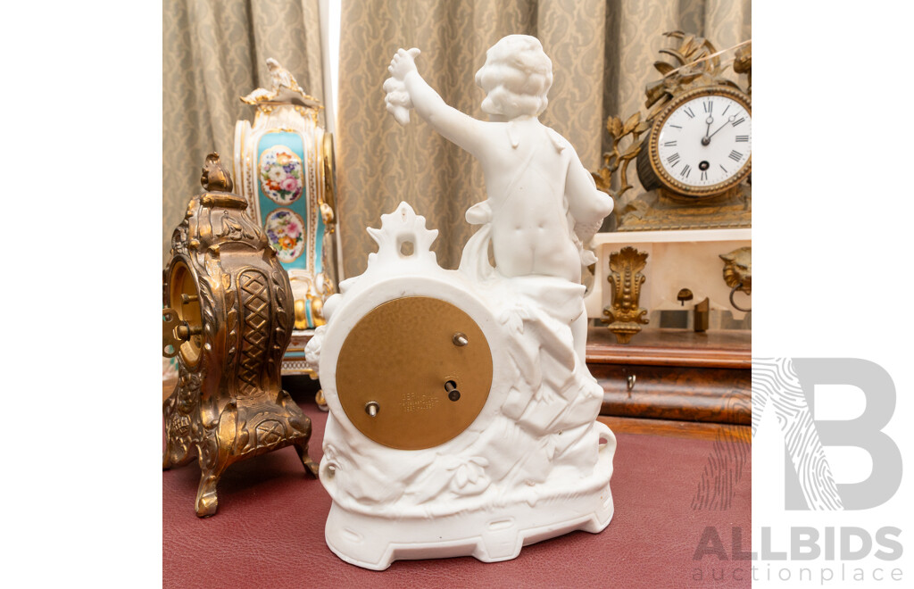 Collection Five Clocks Including Small Brass US Navy Example, Two Reproduction Gilt Style Examples and Bisque Example with Cherub Detail