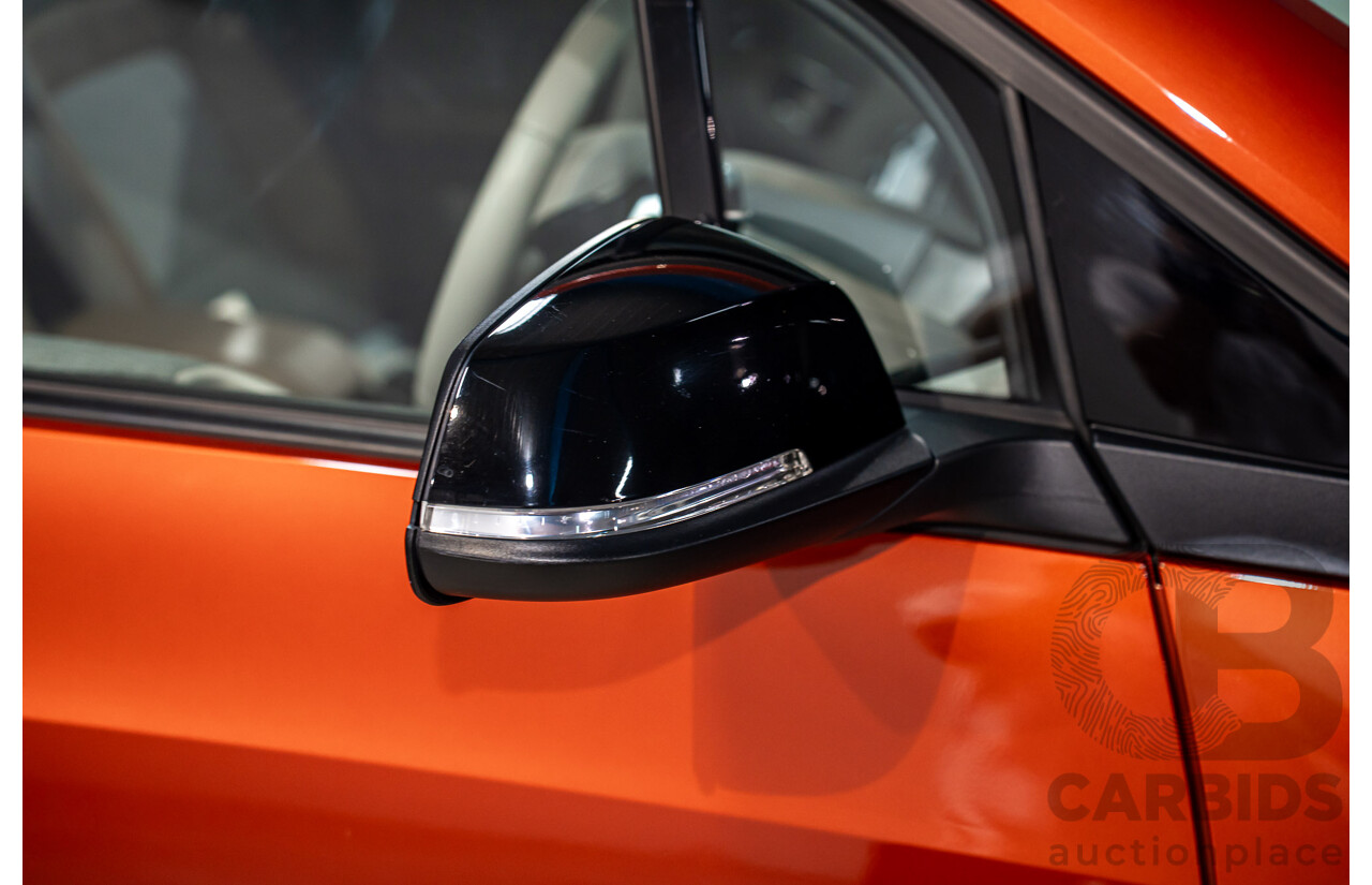05/2015 BMW i3 REx Hybrid (RWD) IO1 4d Hatchback Solar Orange Metallic/Fluid Black 0.6L - 125kW