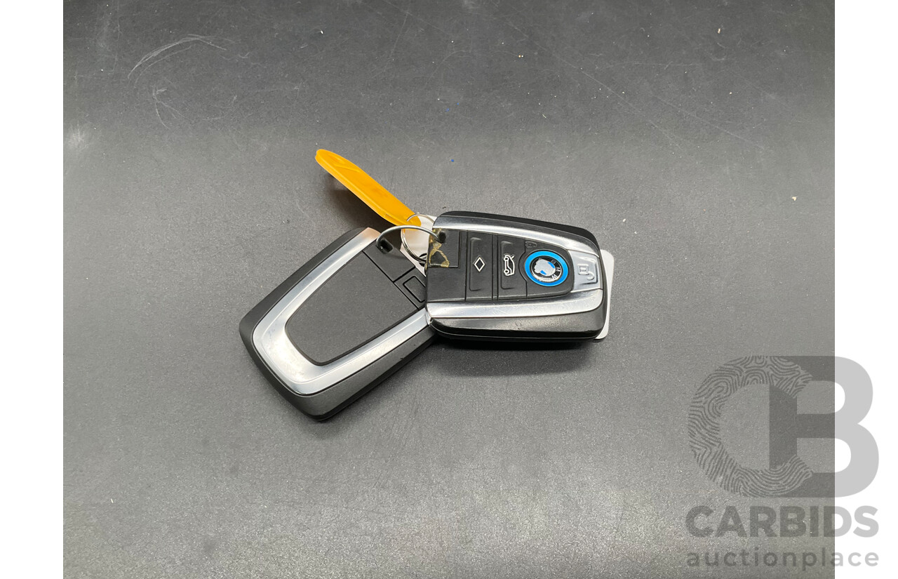 05/2015 BMW i3 REx Hybrid (RWD) IO1 4d Hatchback Solar Orange Metallic/Fluid Black 0.6L - 125kW