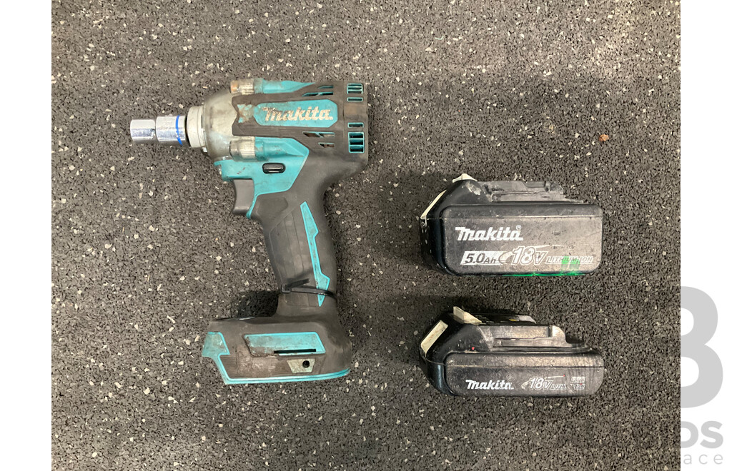 MAKITA 18V Brushless Impact Wrench (DTW300), 18V 5.0AH Battery and 18V 1.3Ah Battery - Lot of 3 - ORP $489