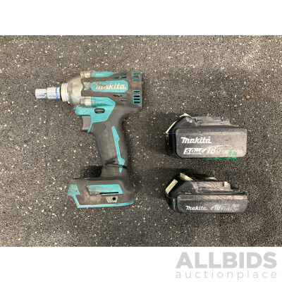 MAKITA 18V Brushless Impact Wrench (DTW300), 18V 5.0AH Battery and 18V 1.3Ah Battery - Lot of 3 - ORP $489