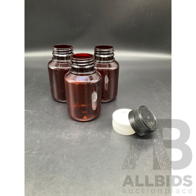 Large Bag Filled with Amber Plastic Bottles