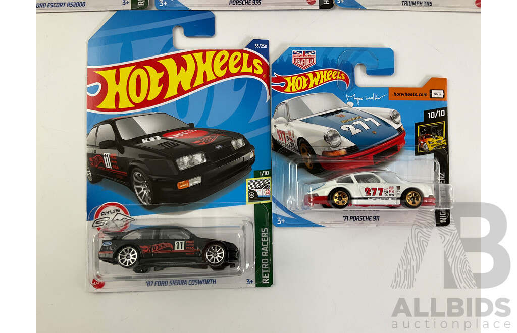 Eight Boxed Hot Wheels Vehicles Including Ford Sierra, Escort, Lancia Delta, Triumph TR6, Porshe 935/911