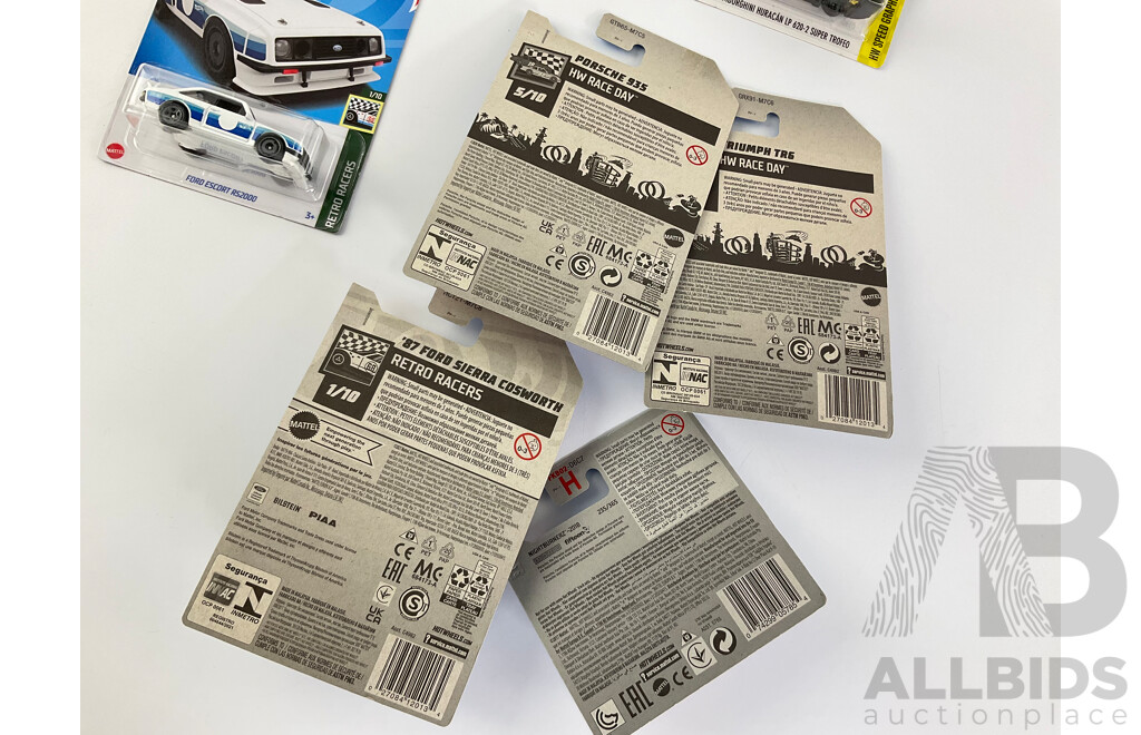 Eight Boxed Hot Wheels Vehicles Including Ford Sierra, Escort, Lancia Delta, Triumph TR6, Porshe 935/911