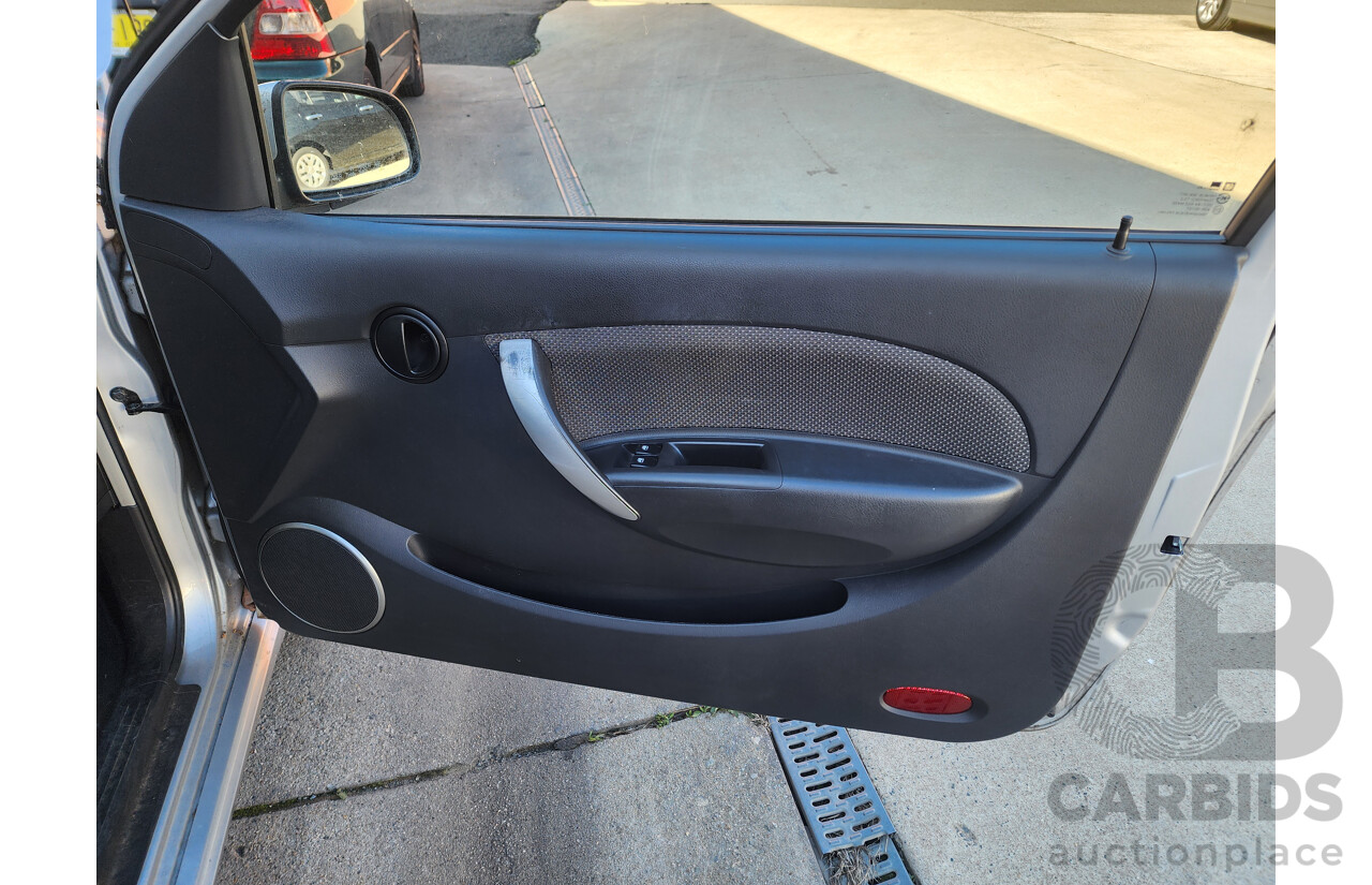 10/2009 Holden Barina  TK MY09 3d Hatchback Silver 1.6L