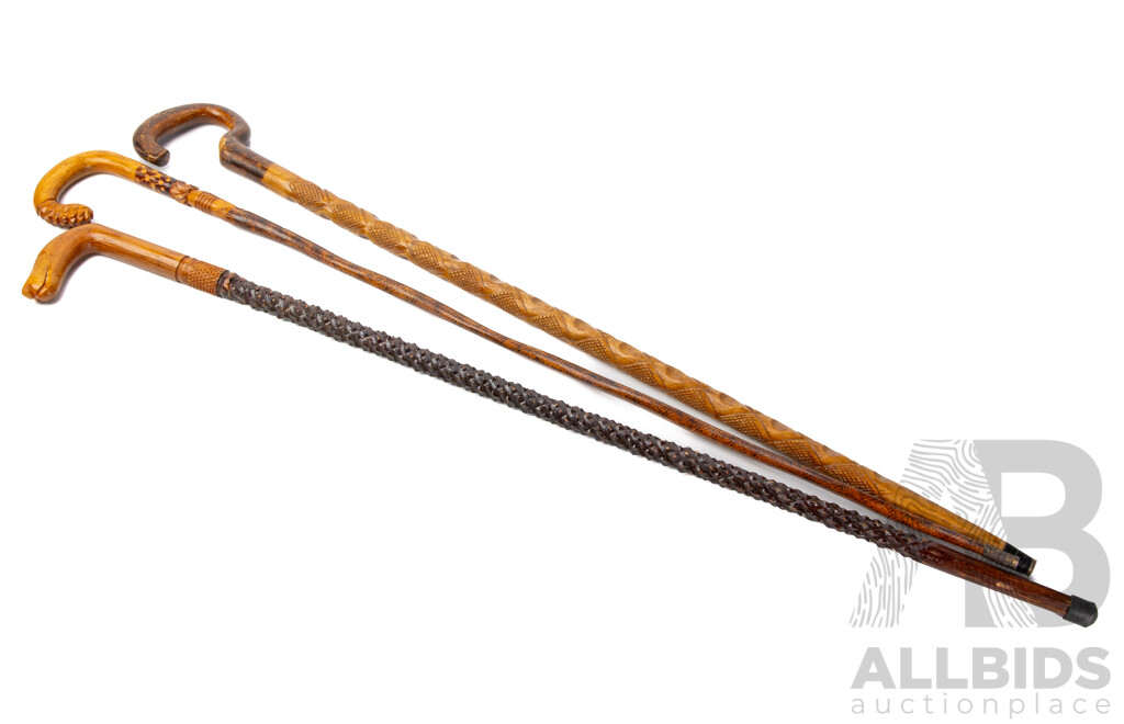 Trio of Indonesian Hand Decorated Wooden Walking Sticks